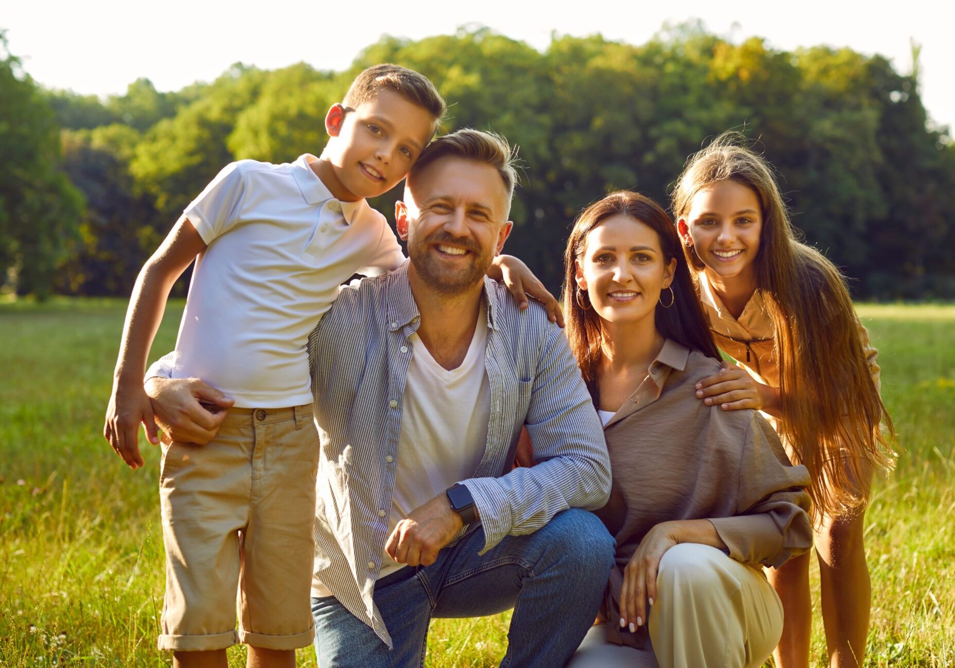 Portrait,Of,Happy,Smiling,Family,With,Son,And,Daughter,Sitting